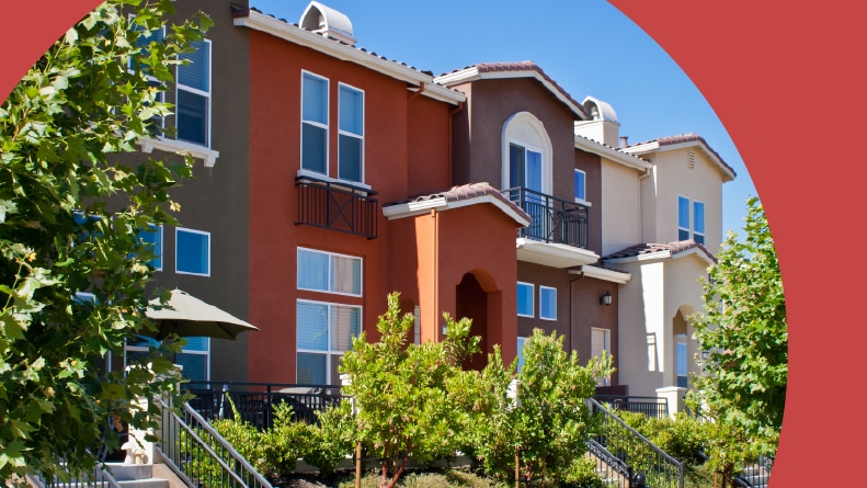 A row of new townhomes with yellow, gray, and dark red exteriors in San Jose, California.