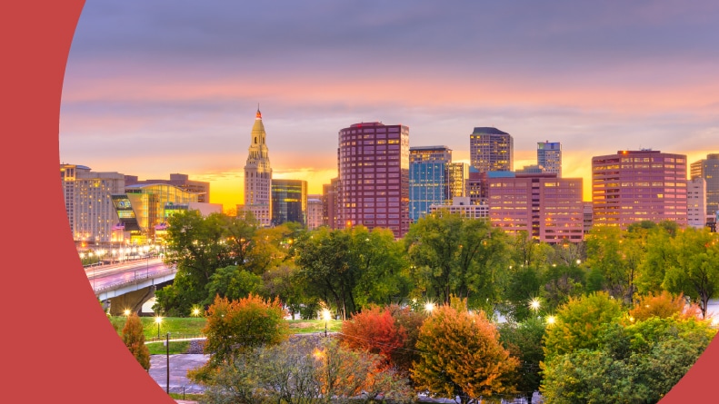 The downtown skyline of Hartford, Connecticut at sunset.
