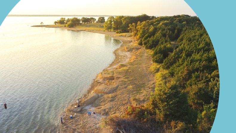 Aerial view of people bank fishing at Ticky Creek Park at the northern end of Lake Lavon in Princeton, Texas.
