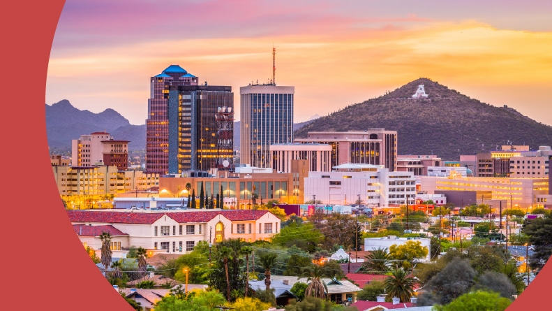 The downtown skyline of Tucson, Arizona with Sentinel Peak at dusk.