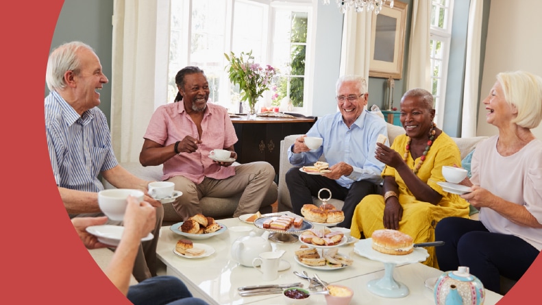 A group of 55+ friends enjoying afternoon tea together.