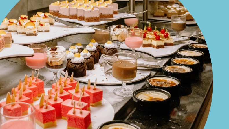 Desserts, pastries, and cakes in a buffet.