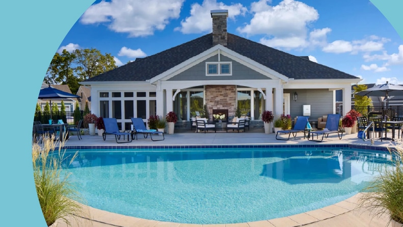 Lounge chairs beside the outdoor pool at The Courtyards at Walters Farm in Huntersville, North Carolina.