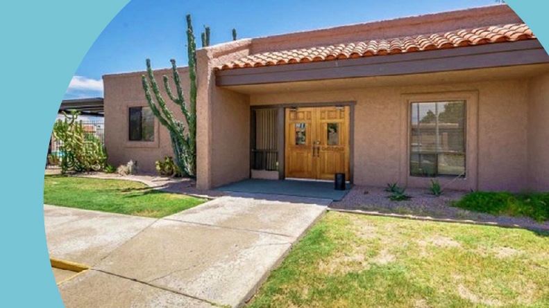 Exterior view of a community building at Las Alegres in Mesa, Arizona.