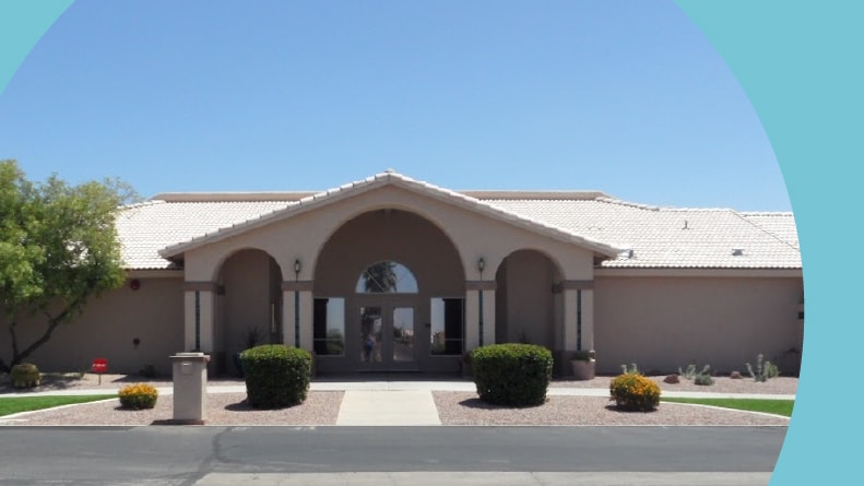 Exterior view of the clubhouse at Meridian Manor in Apache Junction, Arizona.