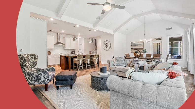 Interior view of a living room and kitchen area in a model home at The Artisan at Victory in Acworth, Georgia.