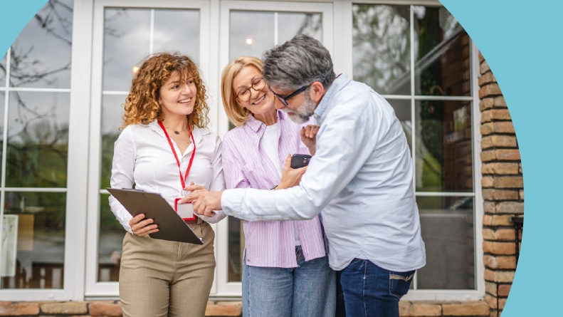 A real estate agent working with a 55+ couple to sell their home.