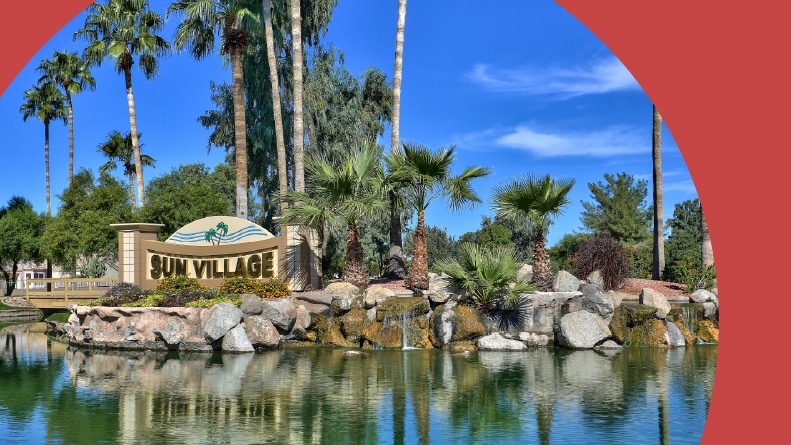 A pond beside the community sign at Sun Village in Surprise, Arizona.