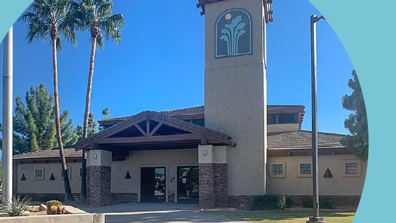 Palm trees beside the clubhouse at Sunland Springs Village in Mesa, Arizona.