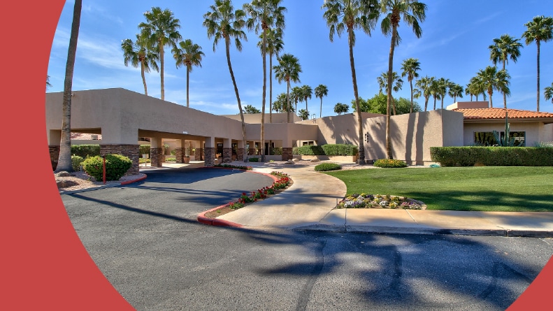Palm trees surrounding the entrance to Westbrook Village in Peoria, Arizona.