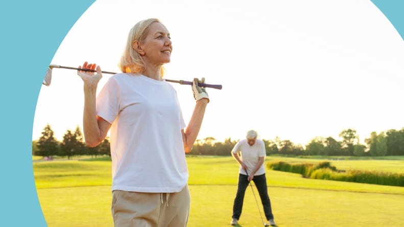 A 55+ woman golfer with a club on a golf course at sunset.