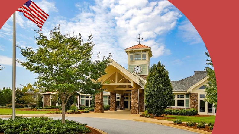 The clocktower and clubhouse at the entrance to Del Webb at Lake Oconee in Greensboro, Georgia.