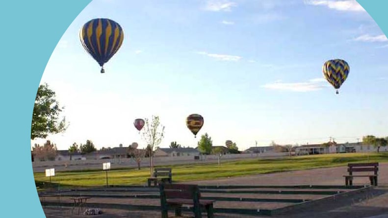 Hot air balloons above the bocce ball courts at Desert Greens in Pahrump, Nevada.