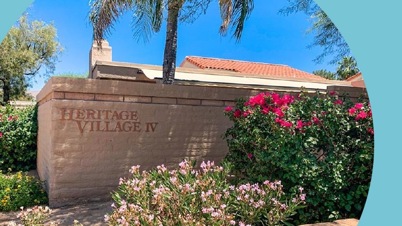 The community name on a brick wall at Heritage Village IV in Scottsdale, Arizona.