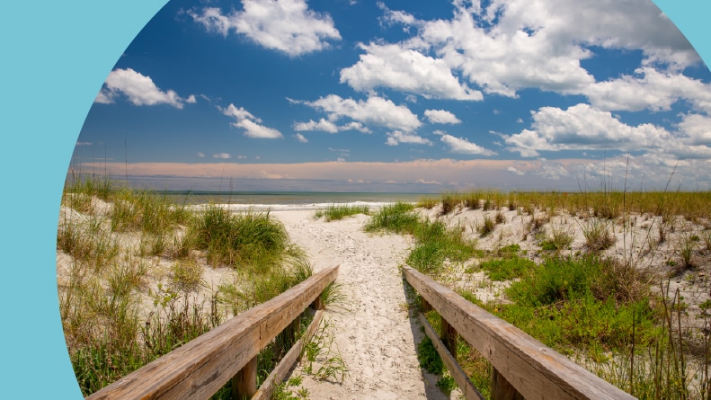 A pathway to Jacksonville Beach in Florida on a sunny day.
