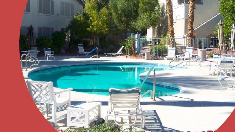 Lounge chairs beside the outdoor pool at Silver Canyon in Las Vegas, Nevada.