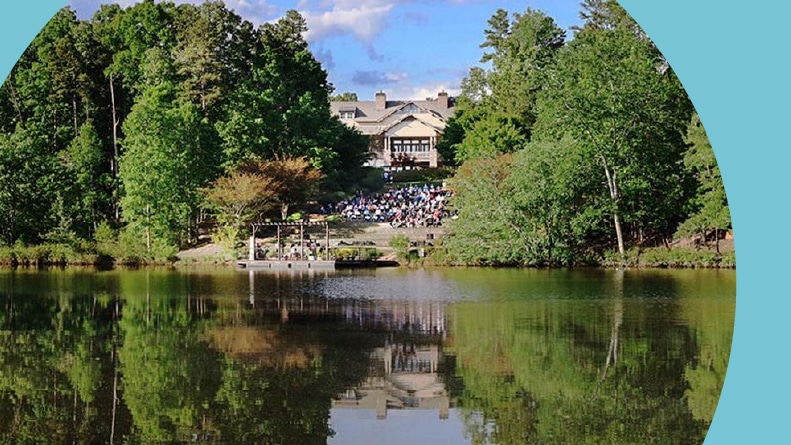 View across the water of a community building on the grounds of Soleil Laurel Canyon in Canton, Georgia.