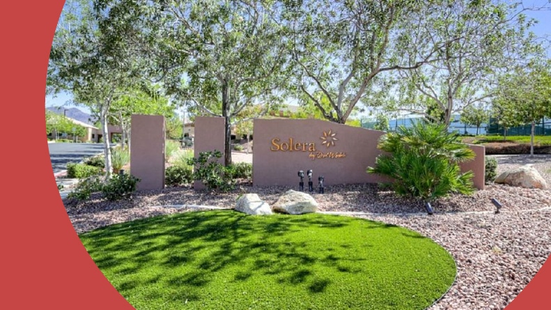 Greenery surrounding the community sign for Solera at Anthem in Henderson, Nevada.