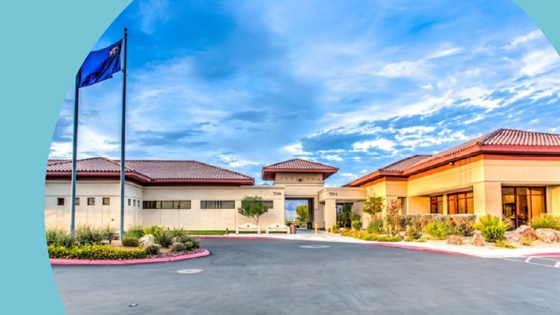 Flag poles beside the entrance to Sun City Aliante in North Las Vegas, Nevada.