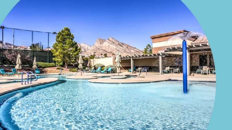 Lounge chairs beside the outdoor pool at Sun City Summerlin in Las Vegas, Nevada.