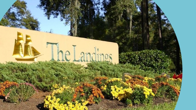 Greenery surrounding the community sign for The Landings on Skidaway Island in Savannah, Georgia.