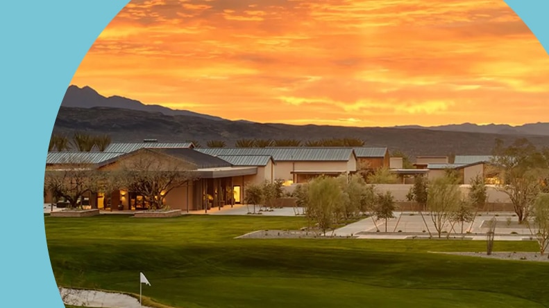 Sunset over the clubhouse and golf course at Trilogy at Verde River in Rio Verde, Arizona.
