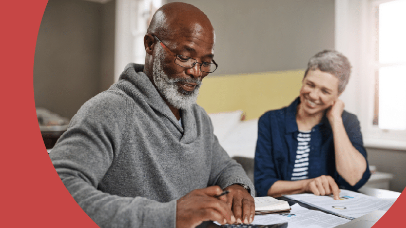 A 55+ couple doing their taxes at home.