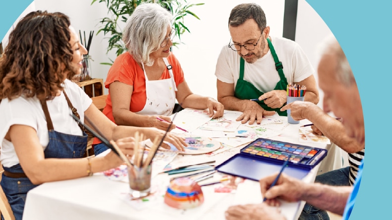 A group of retirees painting in their 55+ community.