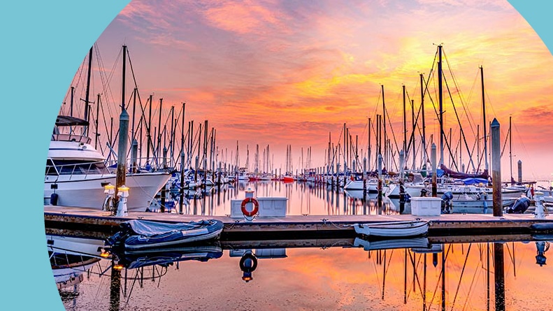 Sunset view of boats at a dock in San Diego, California.