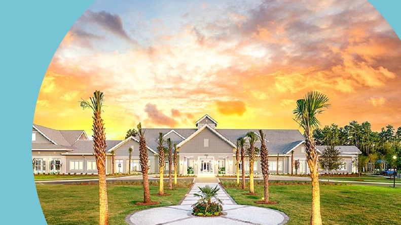 Palm trees lining the pathway to the clubhouse at Del Webb Charleston at Nexton in Summerville, South Carolina.