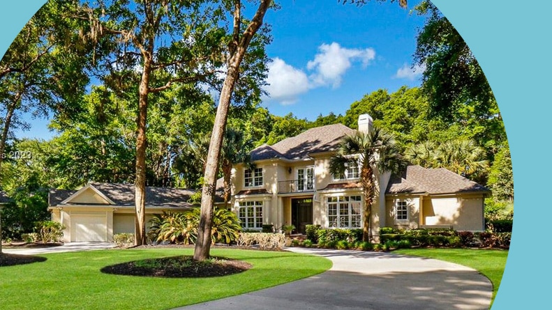 Trees surrounding a large house at Indigo Run in Hilton Head Island, South Carolina.