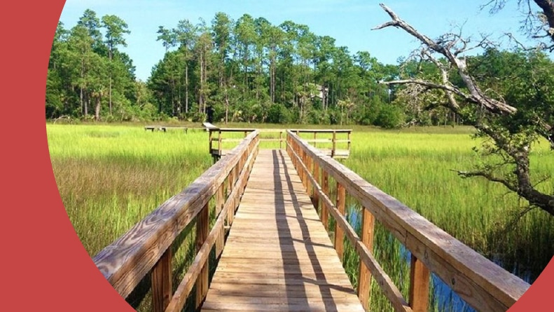 A boardwalk over a marsh on the grounds of Liberty Cottages at Park West in Mt. Pleasant, South Carolina.