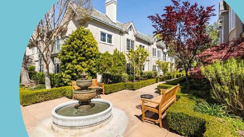 A bench beside a fountain on the grounds of Parc Regent Condominium in Los Altos, California.