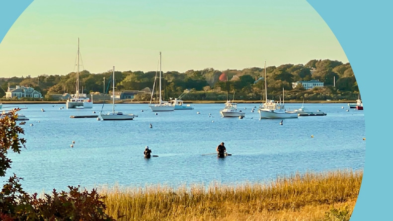 Boats and kayakers along the shores of Provincetown in Cape Cod, Massachusetts.