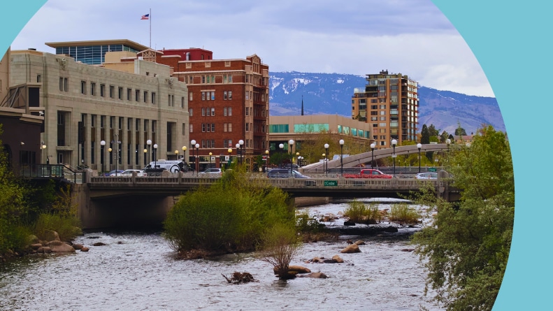 Cars driving over Truckee River in Downtown Reno.