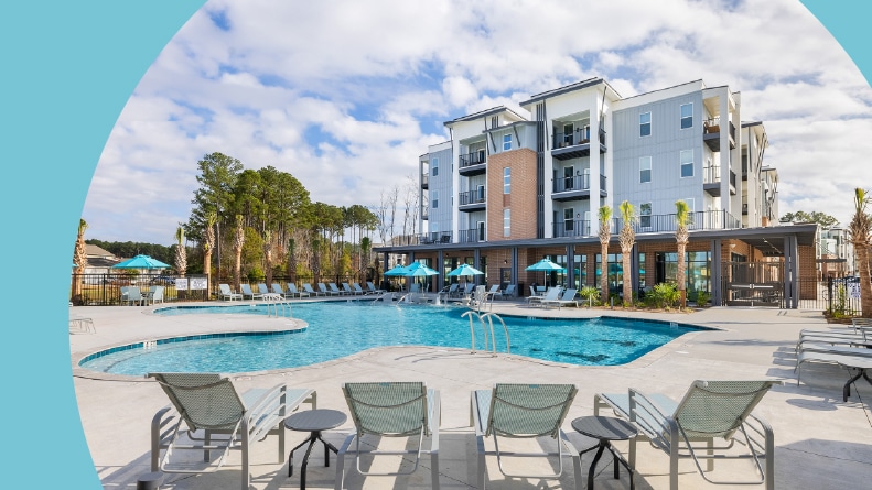 Lounge chairs beside the outdoor pool at Encore – Restore at Carolina Park in Mt. Pleasant, South Carolina.