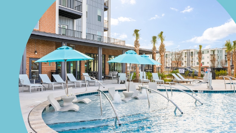 Lounge chairs beside the outdoor pool at Restore at Carolina Park in Mt. Pleasant, South Carolina.