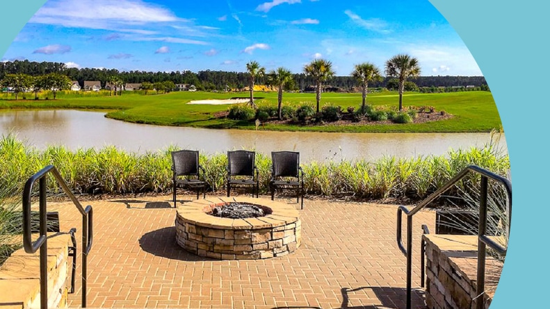 Chairs around a fire pit beside the golf course at Sun City Hilton Head in Bluffton, South Carolina.