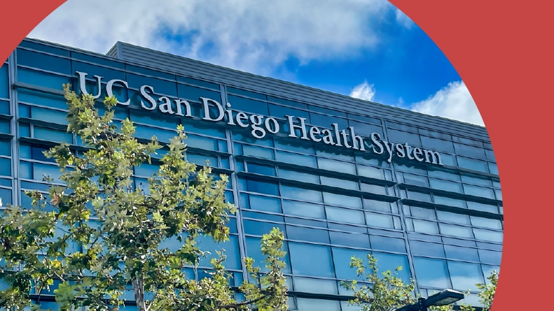 View of the UC San Diego Health System sign on the glass building in La Jolla, California.