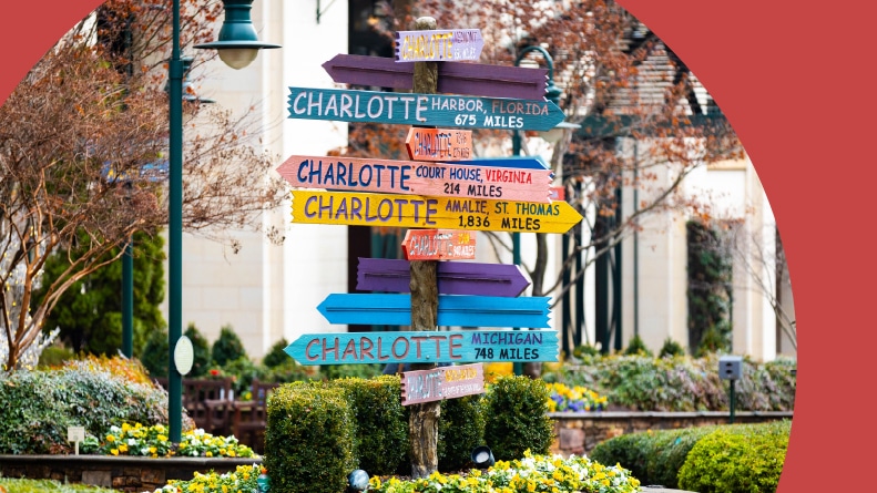 Colorful signs in The Green in Uptown Charlotte on a sunny day.