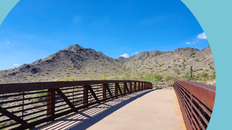 A bridge and mountains in the background at Skyline Regional Park in Buckeye, Arizona.