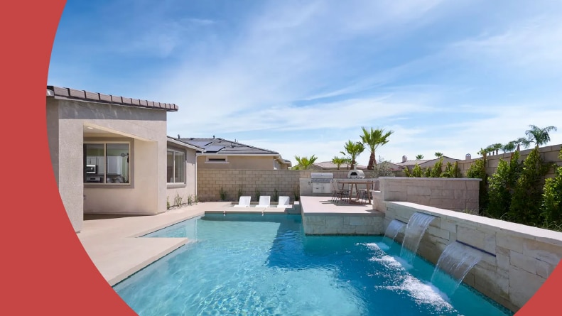 Lounge chairs beside an outdoor pool at a home in Del Webb Explore Palm Desert in Palm Desert, California.