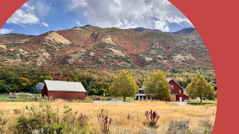 A farm house in Mapleton, Utah with fall colors near the base of Maple Mountain.