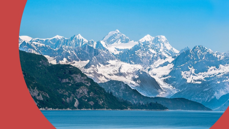 Beautiful coast view of Alaska with snowy mountains in the summer.
