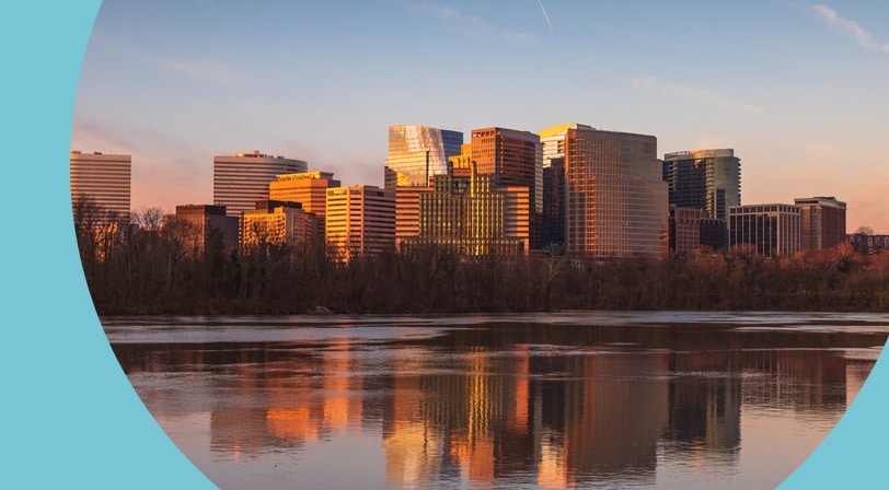 Buildings in Arlington County, Virginia reflecting in the water of the Potomac River in the morning.