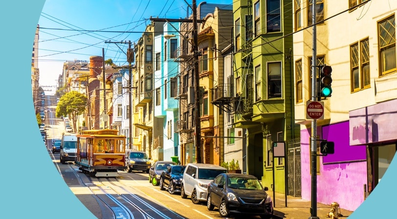 A street in San Francisco, California with a cable car.