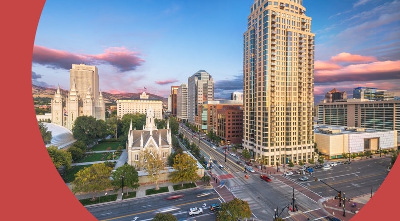 The downtown cityscape of Salt Lake City, Utah over Temple Square at dusk.