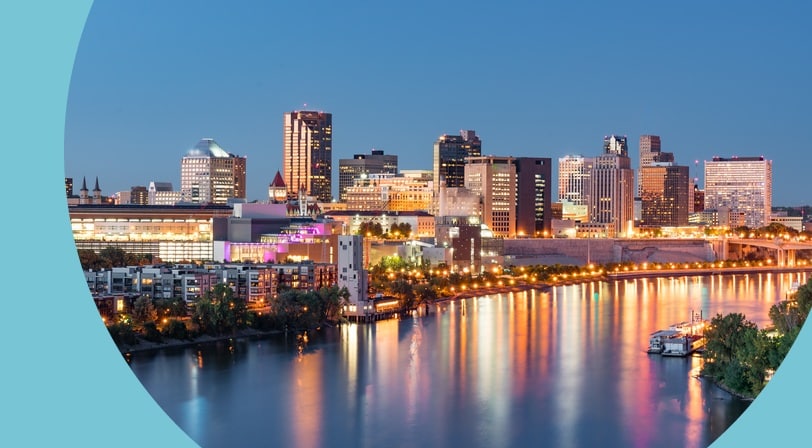 The skyline of St. Paul, Minnesota along the Mississippi River at night.
