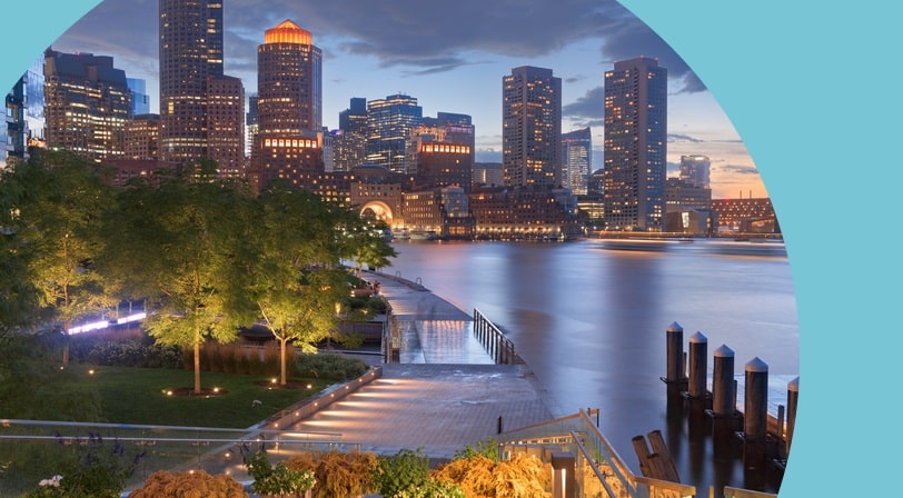 The Boston, Massachusetts skyline and pier at twilight.