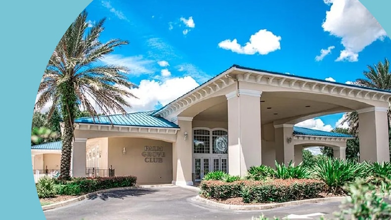 Palm trees beside the Palm Grove Club at Oak Run in Ocala, Florida.